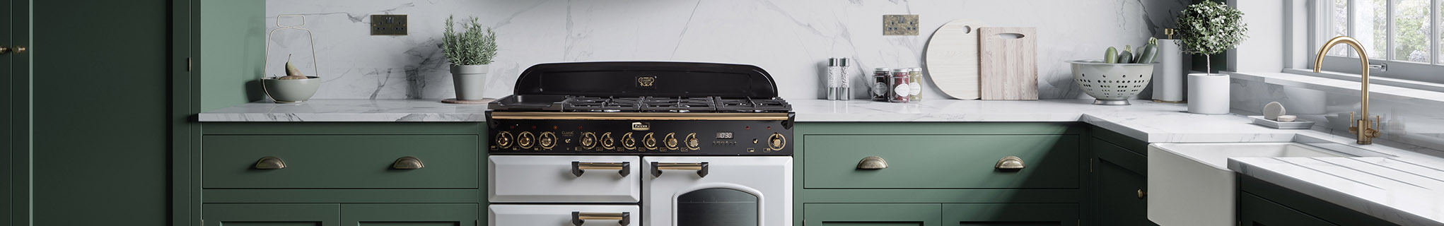Falcon Classic Deluxe in white with brass trim in green kitchen 